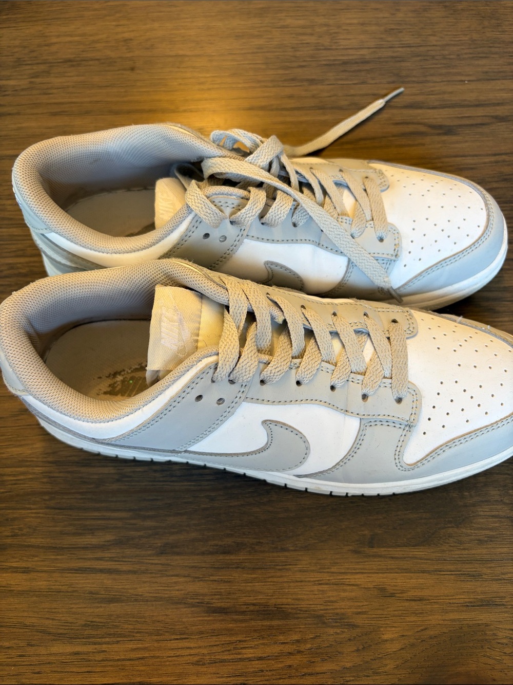 Women’s Nike low dunks in White and Light Gray